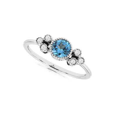 Blue Topaz and Triple Diamond Accented Ring