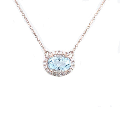 Oval Aquamarine and Diamond Halo Pendant