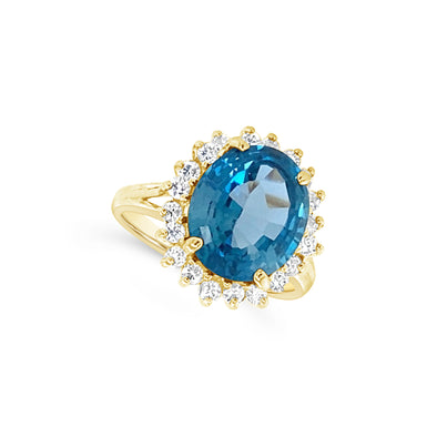 Oval Blue Topaz and Diamond Halo Ring